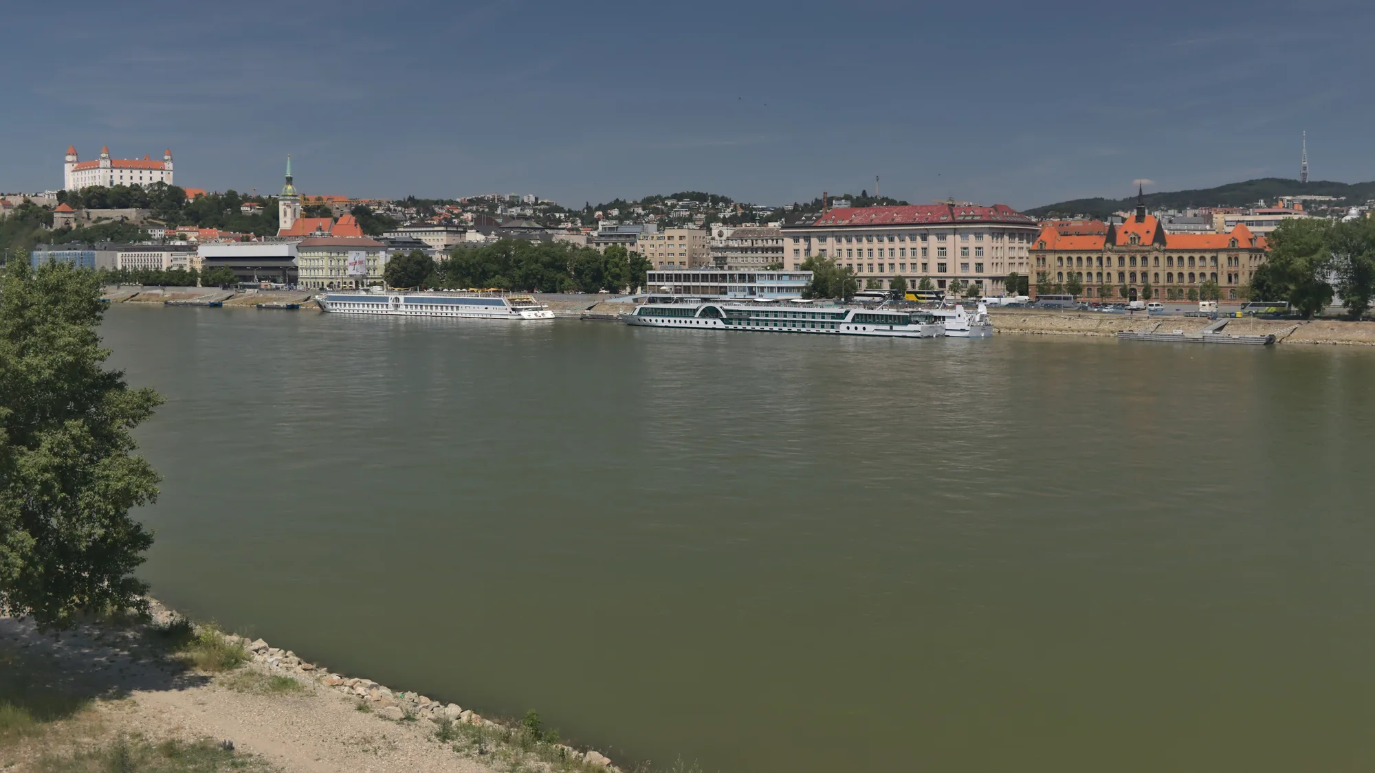 The Danube riverbank in Bratislava with the castle and St. Martin’s spire on the skyline